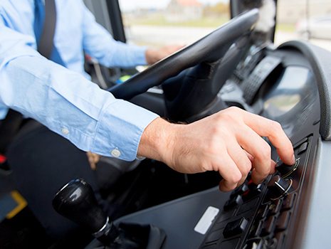 Bus driver operating the bus.