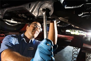 unnamed Mechanic fixing commercial bus.